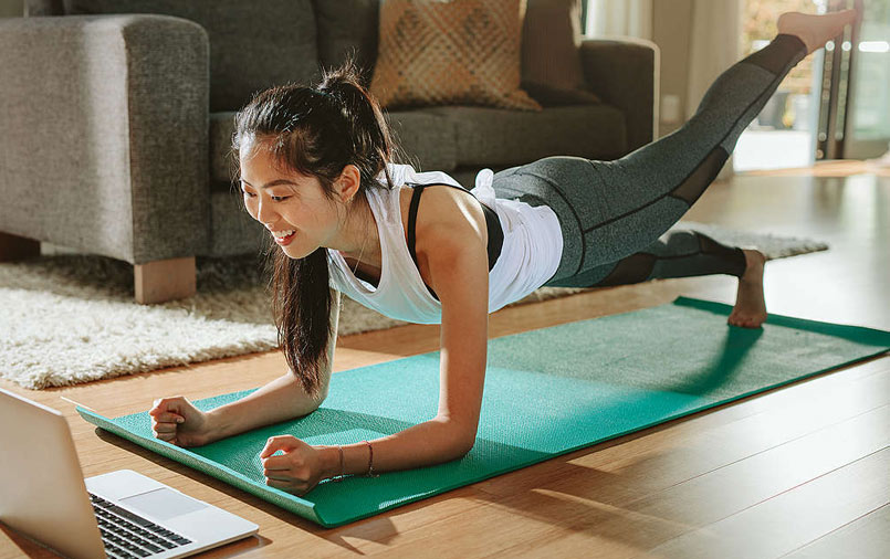 Woman watching an online yoga session