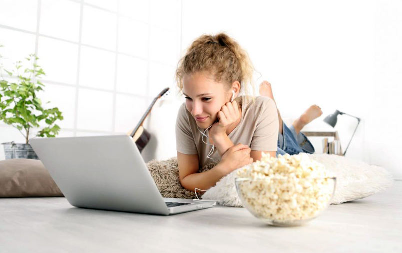Woman enjoys streaming her favourite movie
